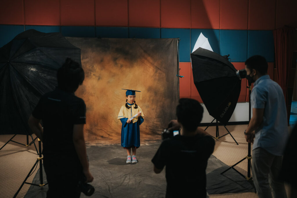 Young graduates celebrating their kindergarten graduation with a photoshoot